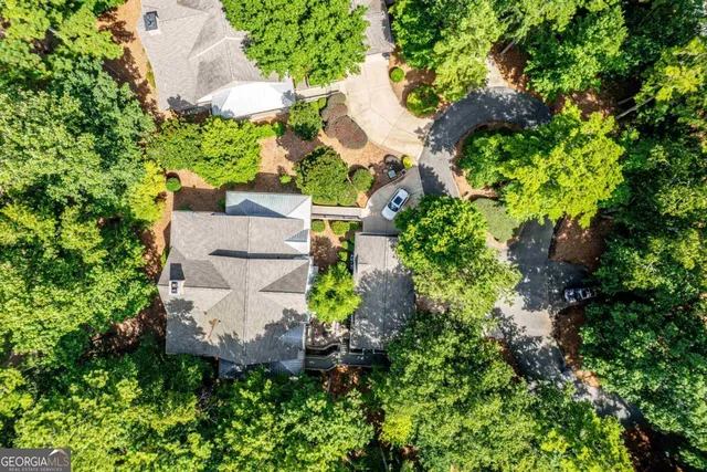 a backyard of a house with lots of green space and garden