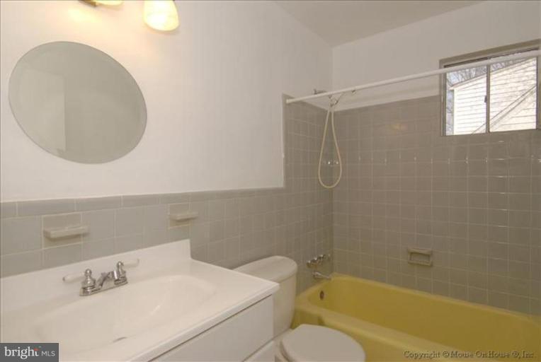 10114 Renfrew Road Silver Spring, MD 20901 - Photo 12 of 27 a bathroom with a sink a toilet and bathtub