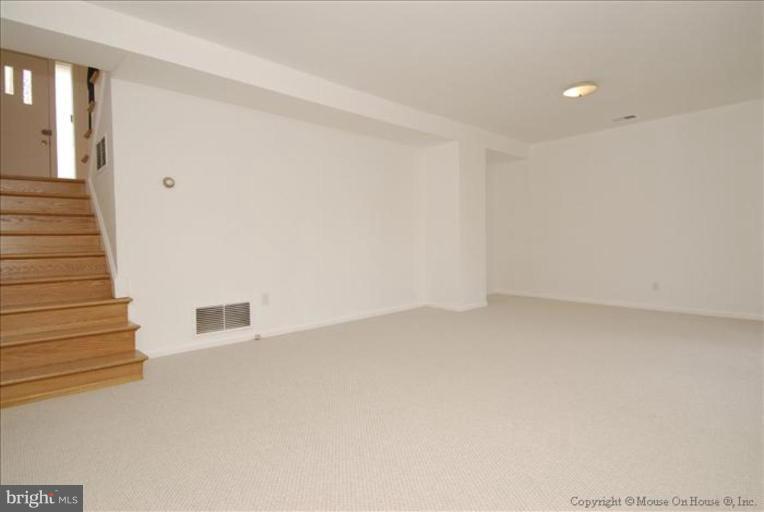 10114 Renfrew Road Silver Spring, MD 20901 - Photo 3 of 27 a view of an empty room with stairs