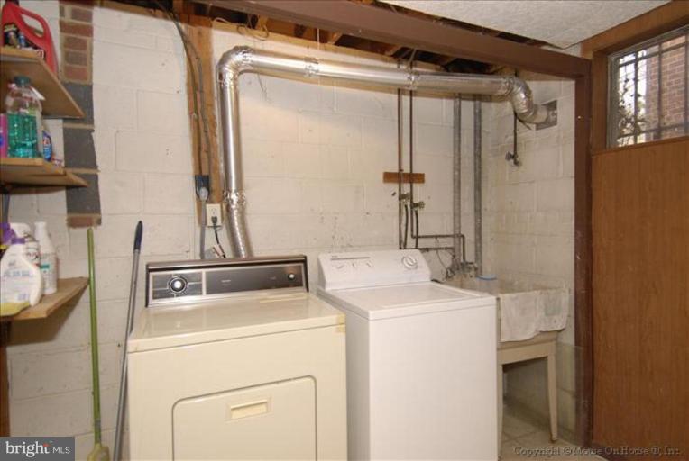 10114 Renfrew Road Silver Spring, MD 20901 - Photo 22 of 27 a utility room with dryer and washer