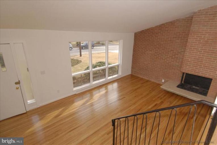 10114 Renfrew Road Silver Spring, MD 20901 - Photo 27 of 27 a view of an empty room and wooden floor