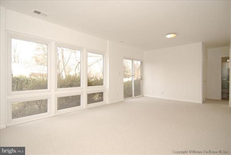 10114 Renfrew Road Silver Spring, MD 20901 - Photo 4 of 27 a view of an empty room with a window