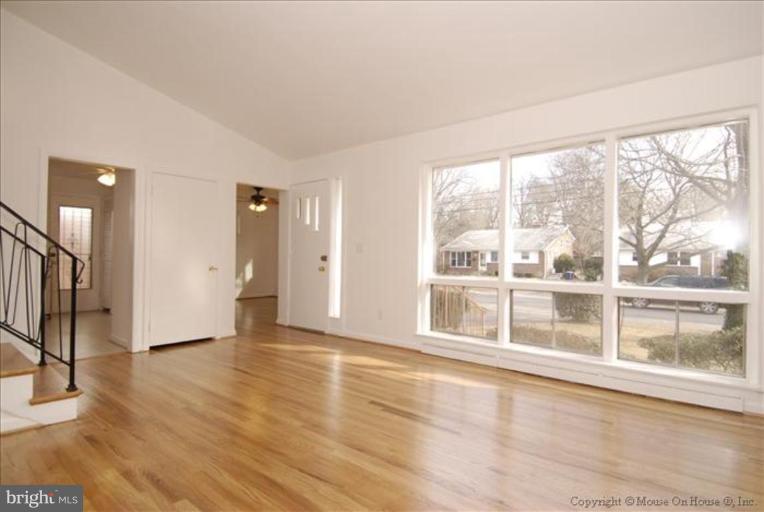 10114 Renfrew Road Silver Spring, MD 20901 - Photo 8 of 27 wooden floor in an empty room with a window