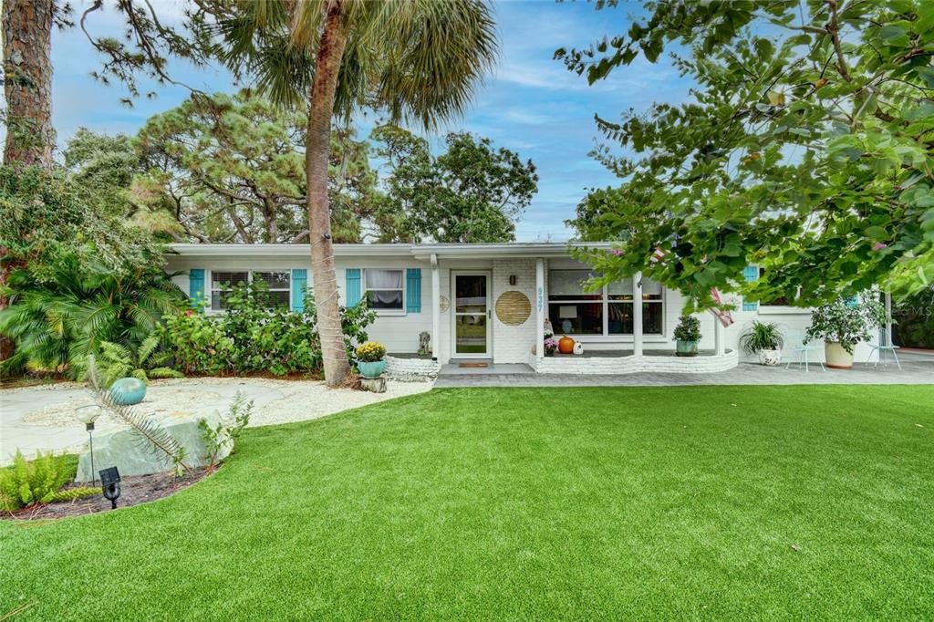 937 Riviera Street Venice, FL 34285 - Photo 1 of 1 a front view of a house with a garden