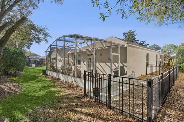 a view of a wrought iron fences in front of house