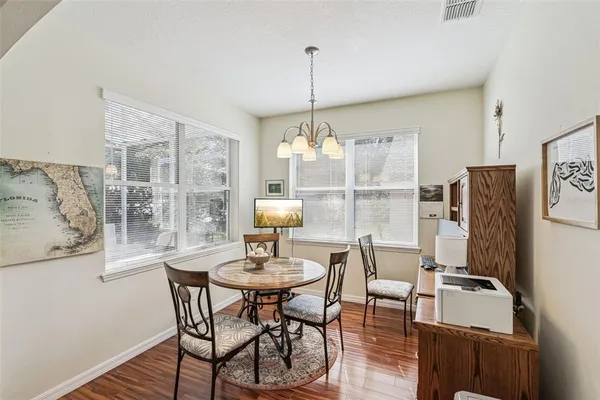 a view of a dining room with furniture window and outside view