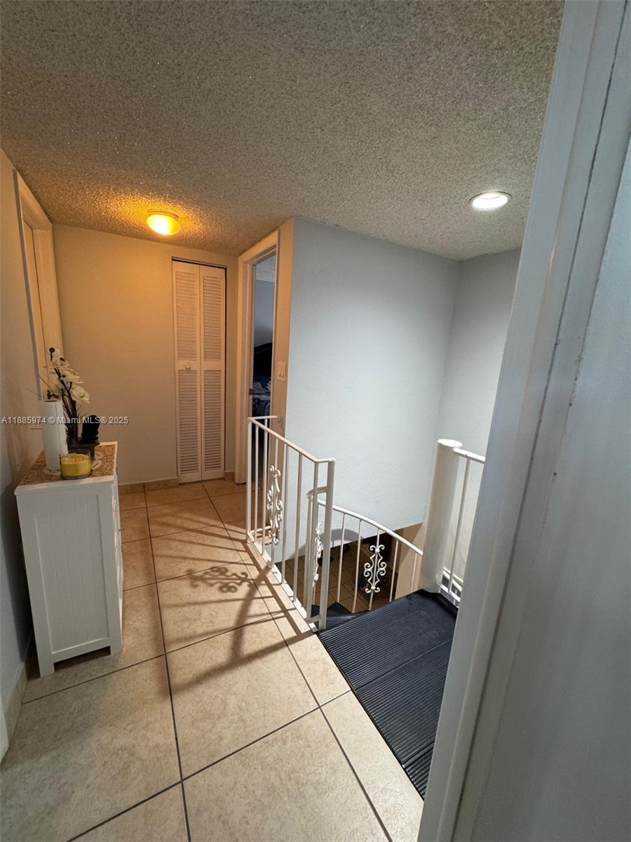 2410 Southwest 122nd Court, Unit 1 Miami, FL 33175 - Photo 14 of 26 a view of a hallway and a livingroom with furniture