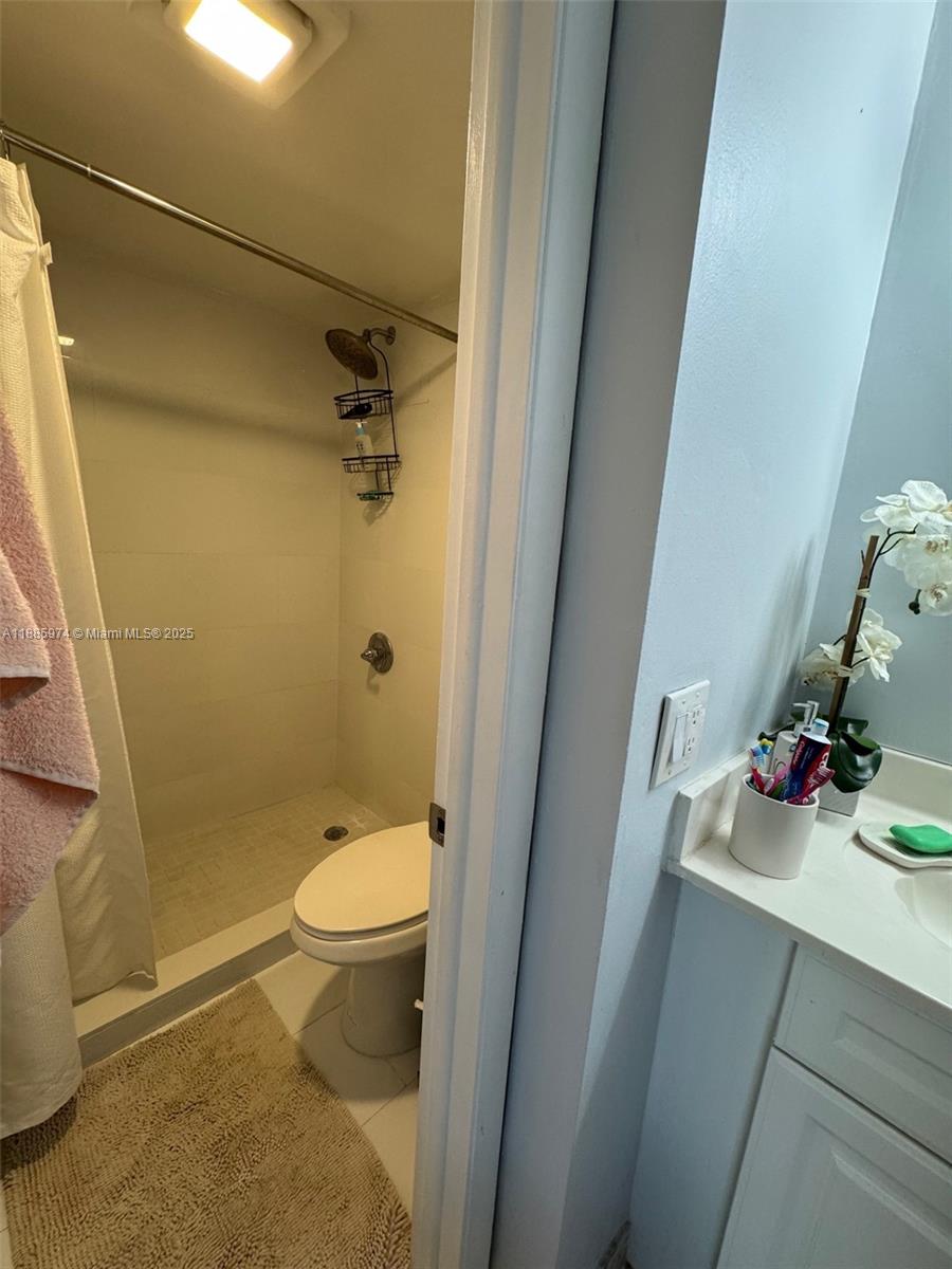 2410 Southwest 122nd Court, Unit 1 Miami, FL 33175 - Photo 15 of 26 a bathroom with a sink a toilet and shower