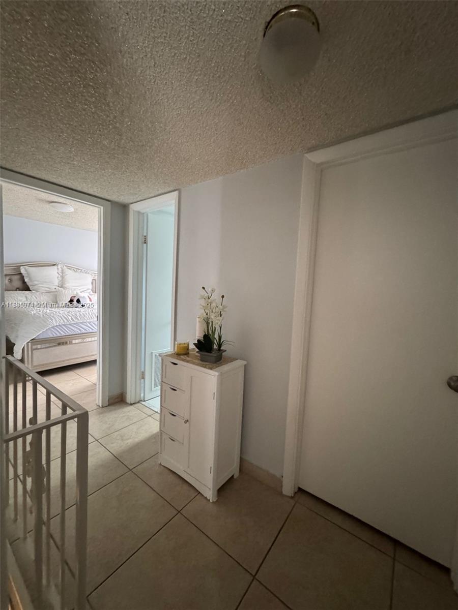 2410 Southwest 122nd Court, Unit 1 Miami, FL 33175 - Photo 17 of 26 a kitchen with stainless steel appliances granite countertop a sink and cabinets
