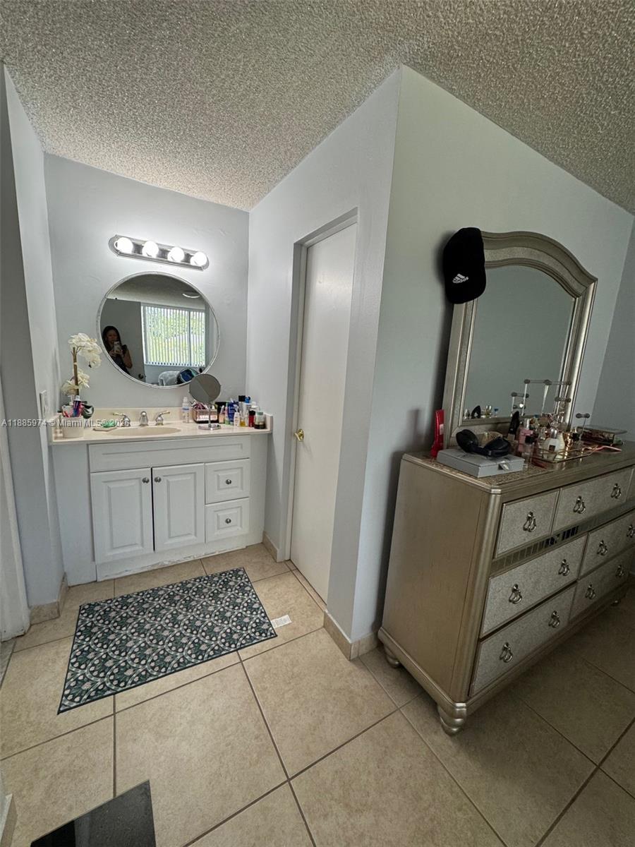2410 Southwest 122nd Court, Unit 1 Miami, FL 33175 - Photo 22 of 26 a room with cabinets and window