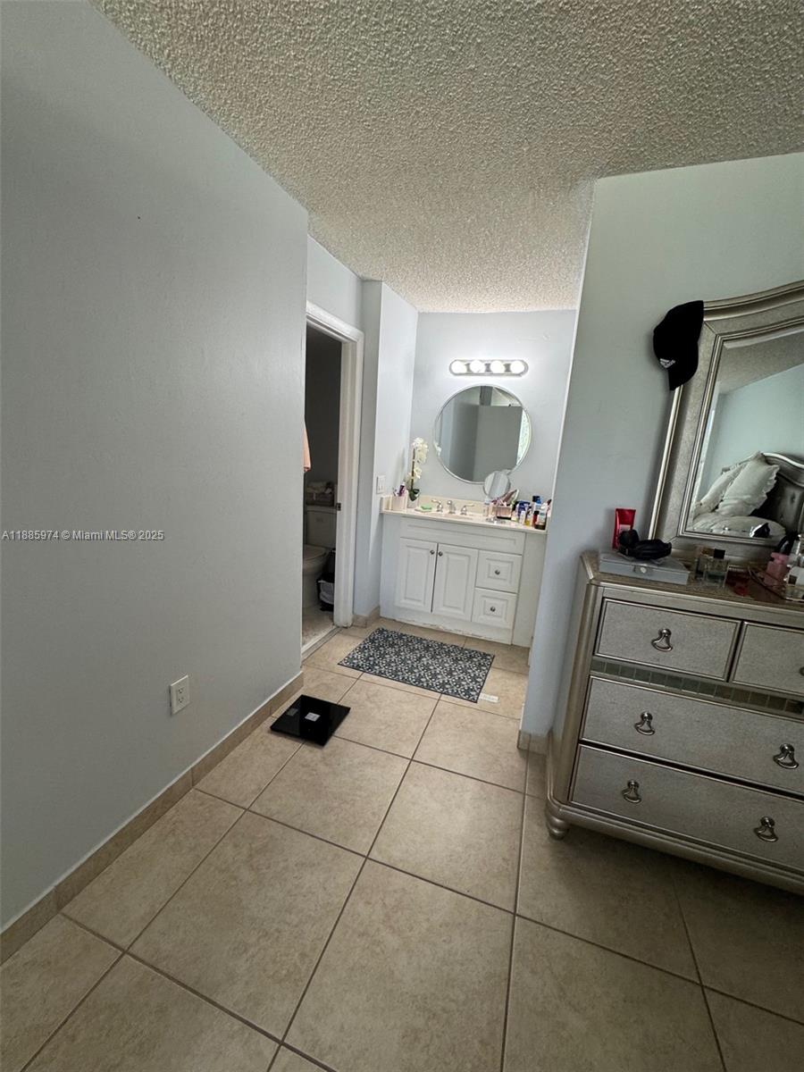 2410 Southwest 122nd Court, Unit 1 Miami, FL 33175 - Photo 23 of 26 a room with a washing machine and cabinets