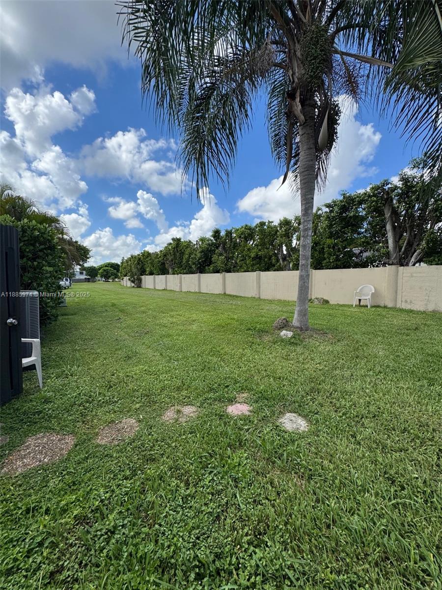 2410 Southwest 122nd Court, Unit 1 Miami, FL 33175 - Photo 26 of 26 a view of a garden with a tree