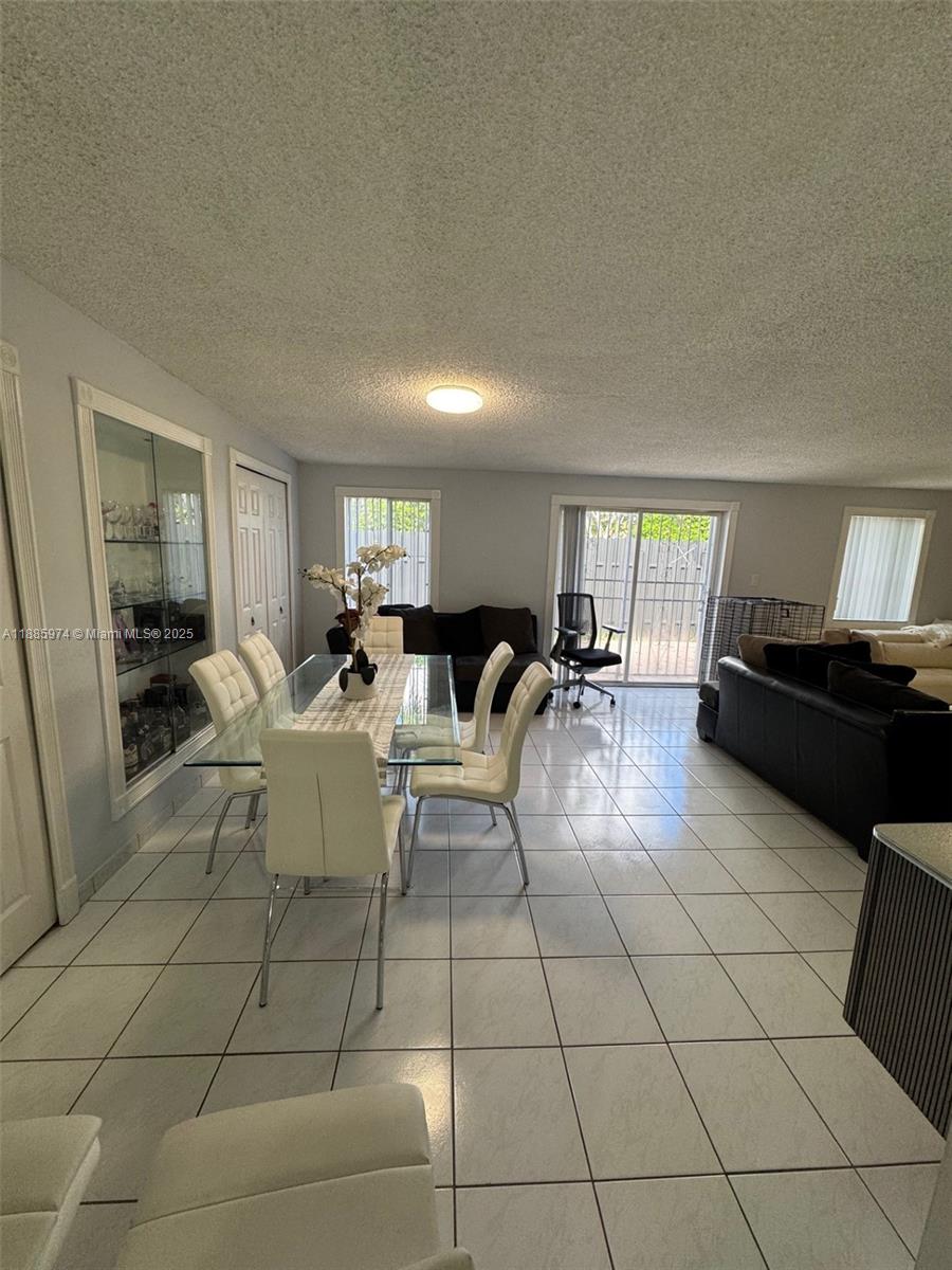 2410 Southwest 122nd Court, Unit 1 Miami, FL 33175 - Photo 3 of 26 a living room with furniture and a window