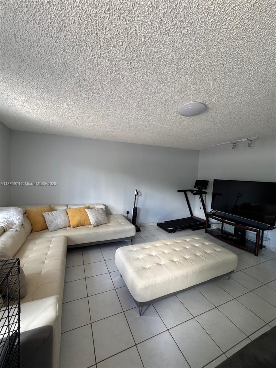2410 Southwest 122nd Court, Unit 1 Miami, FL 33175 - Photo 4 of 26 a living room with furniture and a couch