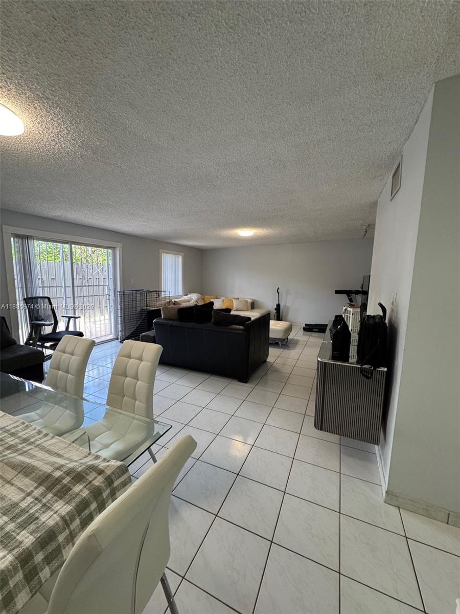 2410 Southwest 122nd Court, Unit 1 Miami, FL 33175 - Photo 5 of 26 a living room with furniture