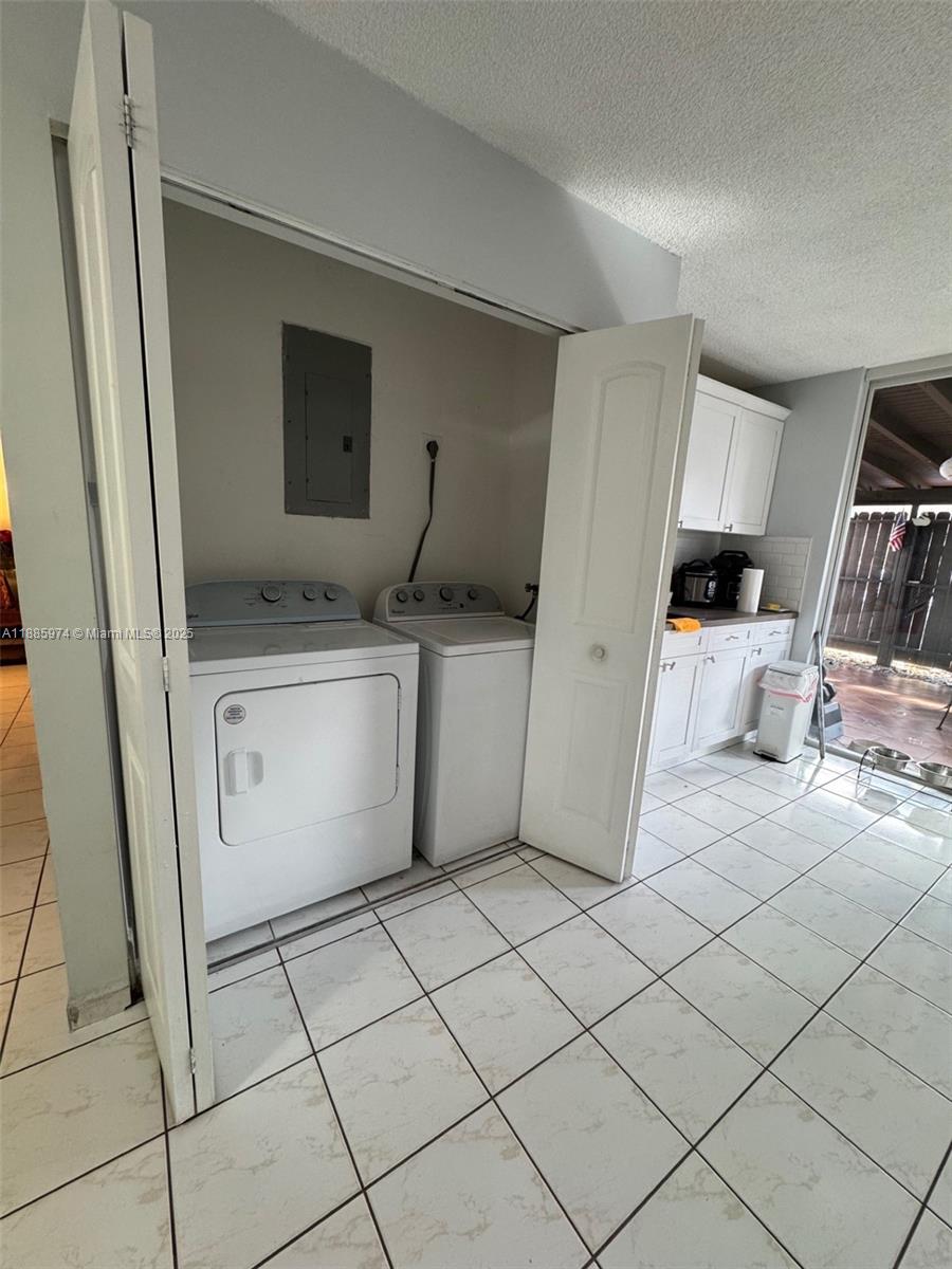2410 Southwest 122nd Court, Unit 1 Miami, FL 33175 - Photo 10 of 26 a kitchen with stainless steel appliances granite countertop a sink and cabinets