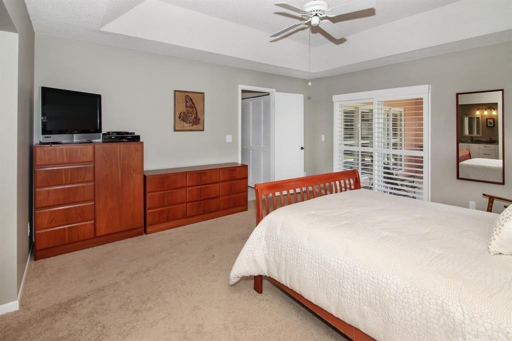 5737 Southwest 89th Way Cooper City, FL 33328 - Photo 12 of 23 a bedroom with a bed and a flat screen tv