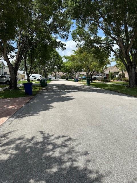 5737 Southwest 89th Way Cooper City, FL 33328 - Photo 19 of 23 a view of a house with a large tree