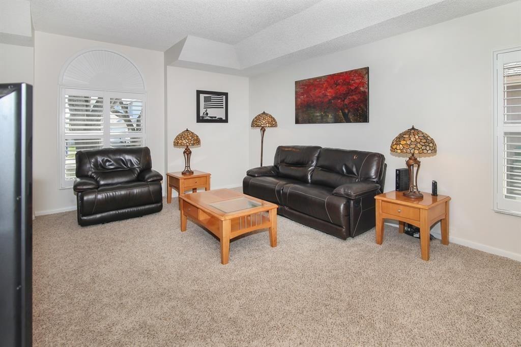 5737 Southwest 89th Way Cooper City, FL 33328 - Photo 10 of 23 a living room with furniture a window and a lamp