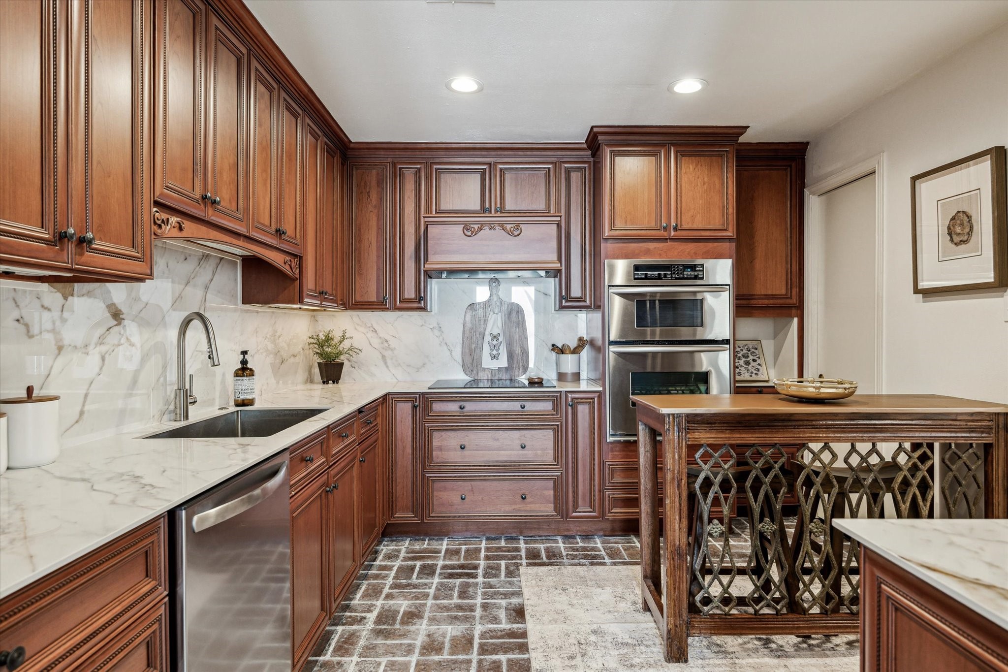 7523 Del Monte Drive Houston, TX 77063 - Photo 11 of 41 a kitchen with stainless steel appliances granite countertop a stove a sink and a microwave
