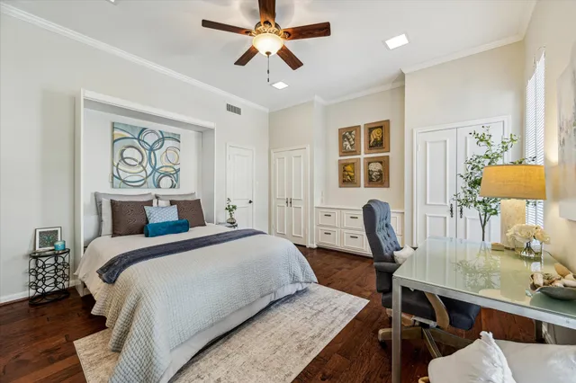 a bedroom with a bed a table and chair