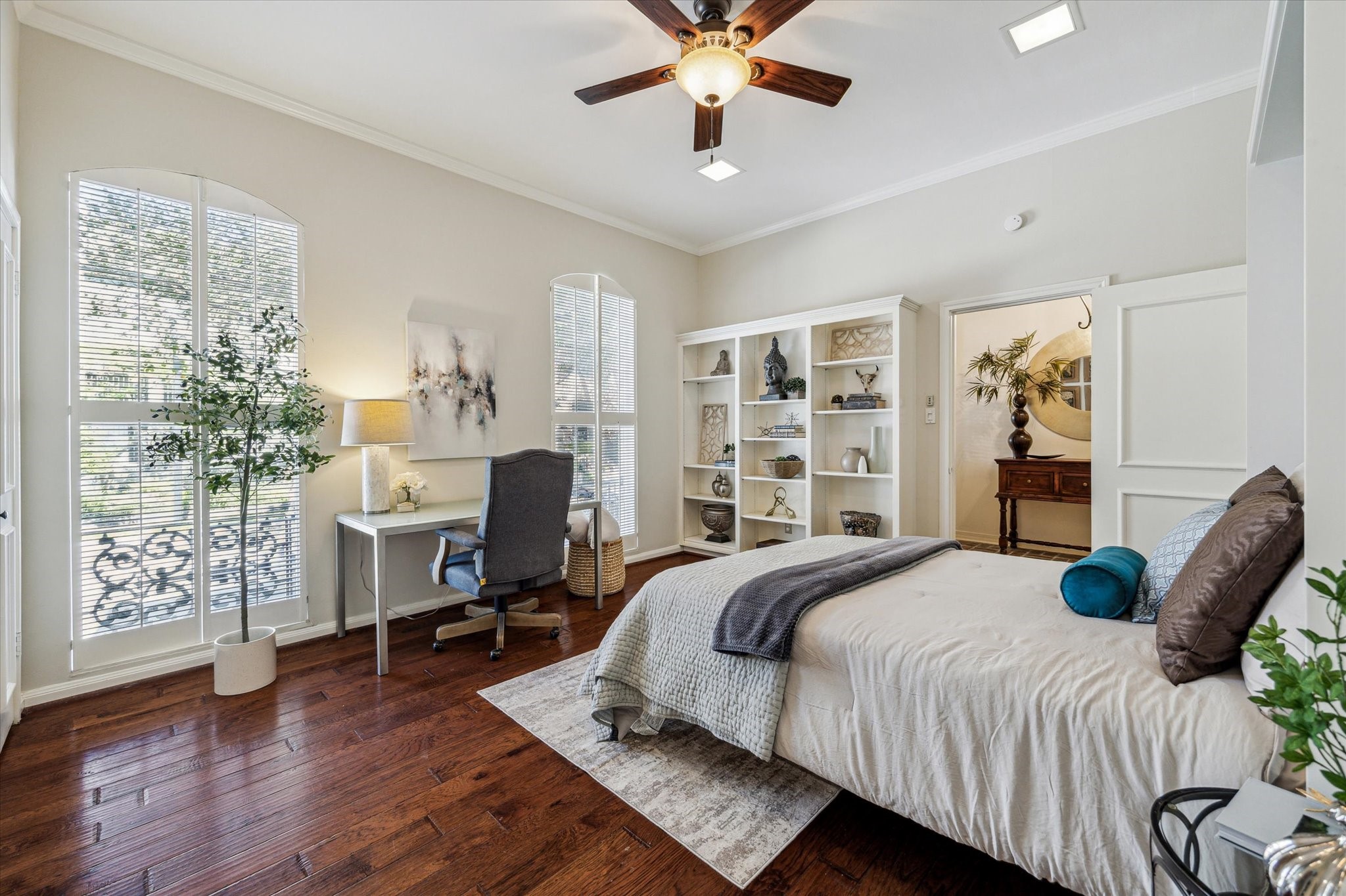 7523 Del Monte Drive Houston, TX 77063 - Photo 15 of 41 a bedroom with a large bed and a chandelier