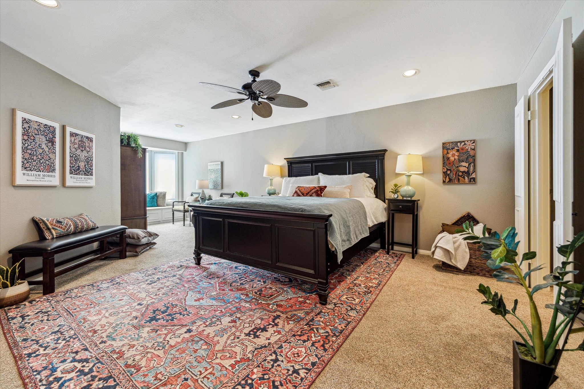 7523 Del Monte Drive Houston, TX 77063 - Photo 19 of 41 a bedroom with a bed and a chandelier