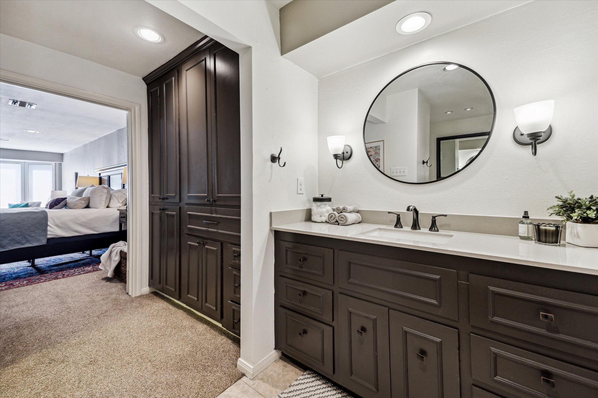 7523 Del Monte Drive Houston, TX 77063 - Photo 23 of 41 a en suite bathroom with a double vanity sink and a mirror