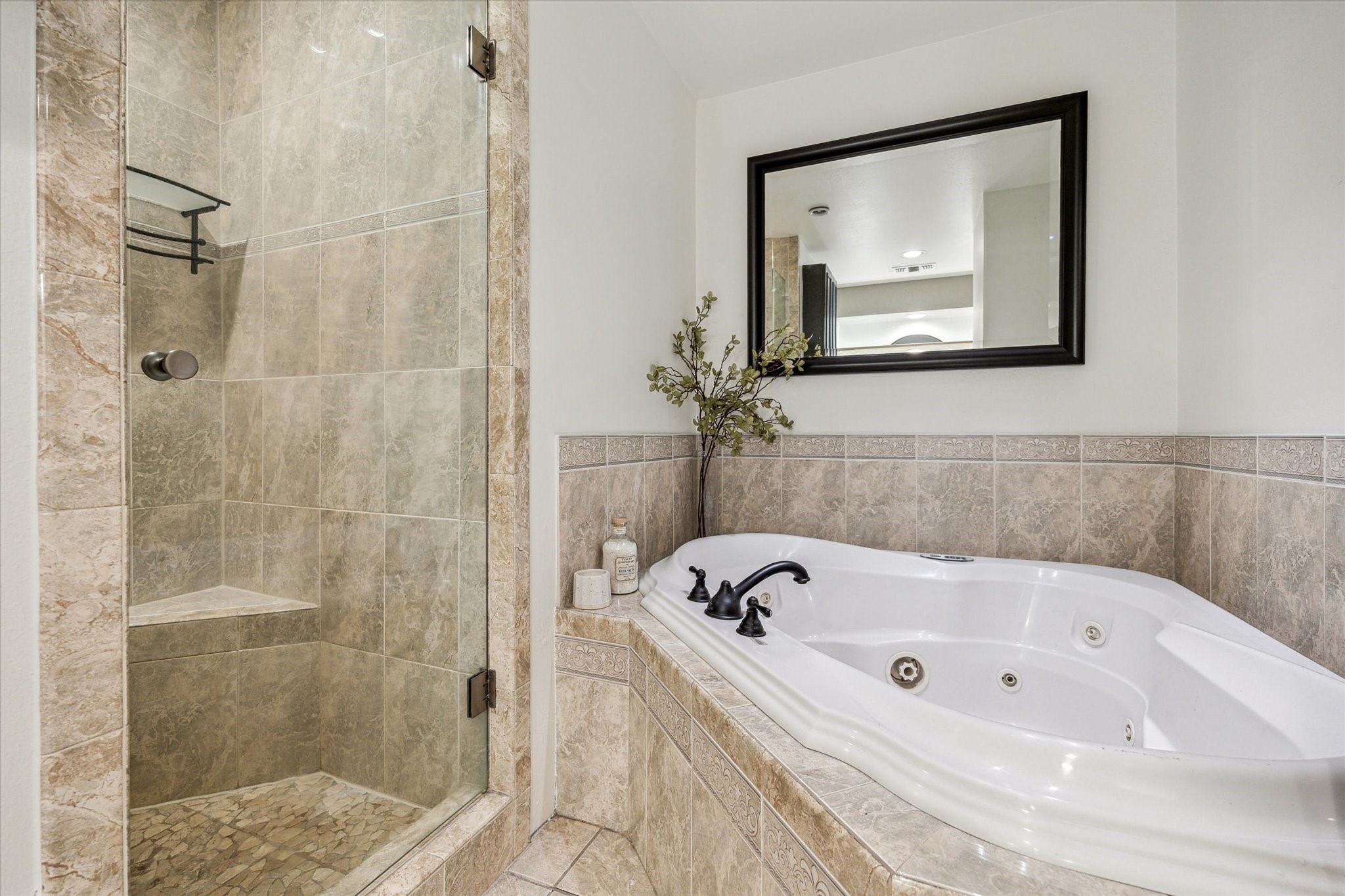 7523 Del Monte Drive Houston, TX 77063 - Photo 24 of 41 a bathroom with a tub and a shower