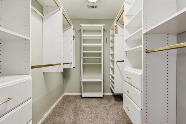 a view of an empty walk in closet