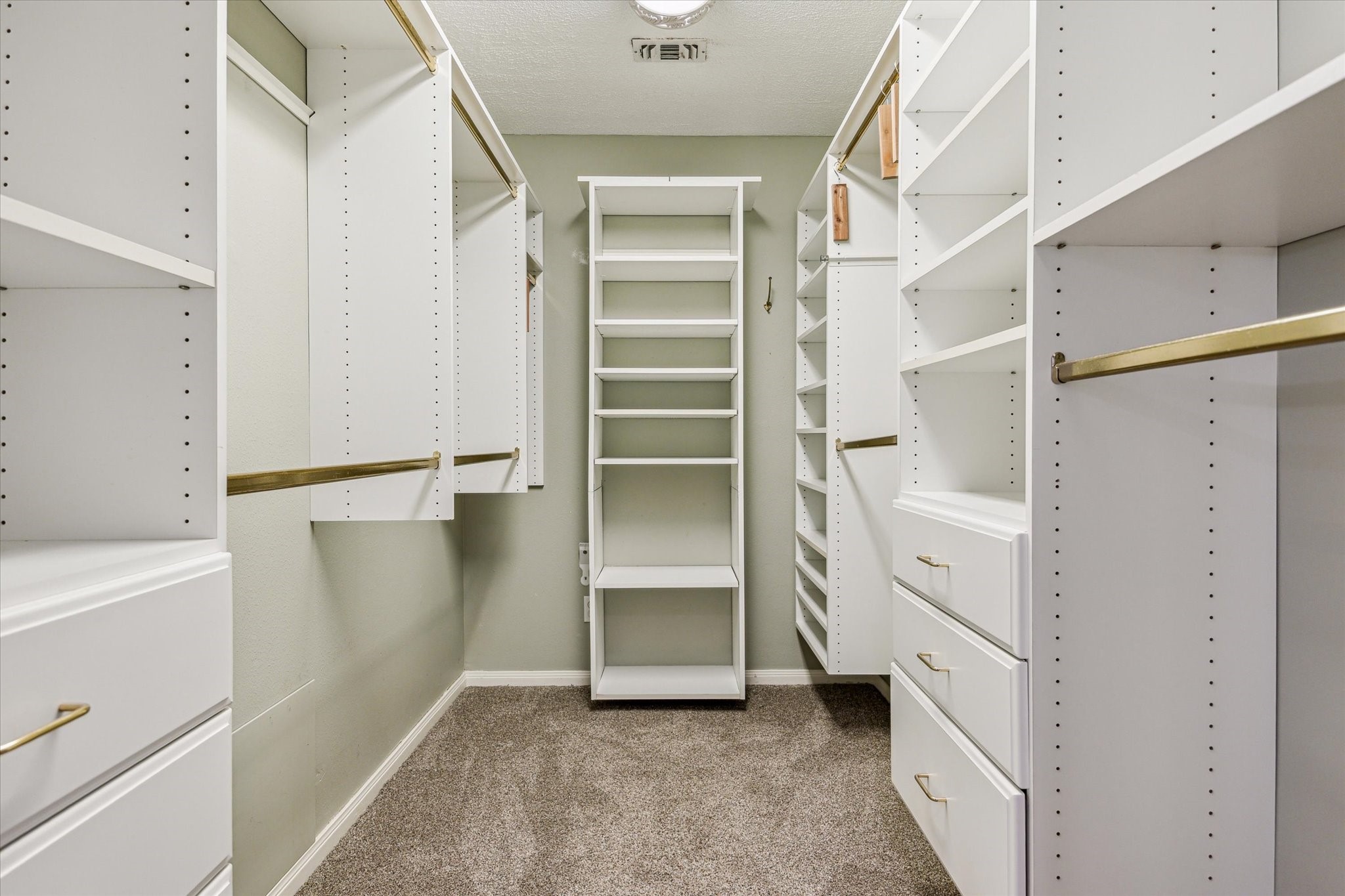 7523 Del Monte Drive Houston, TX 77063 - Photo 25 of 41 a view of an empty walk in closet