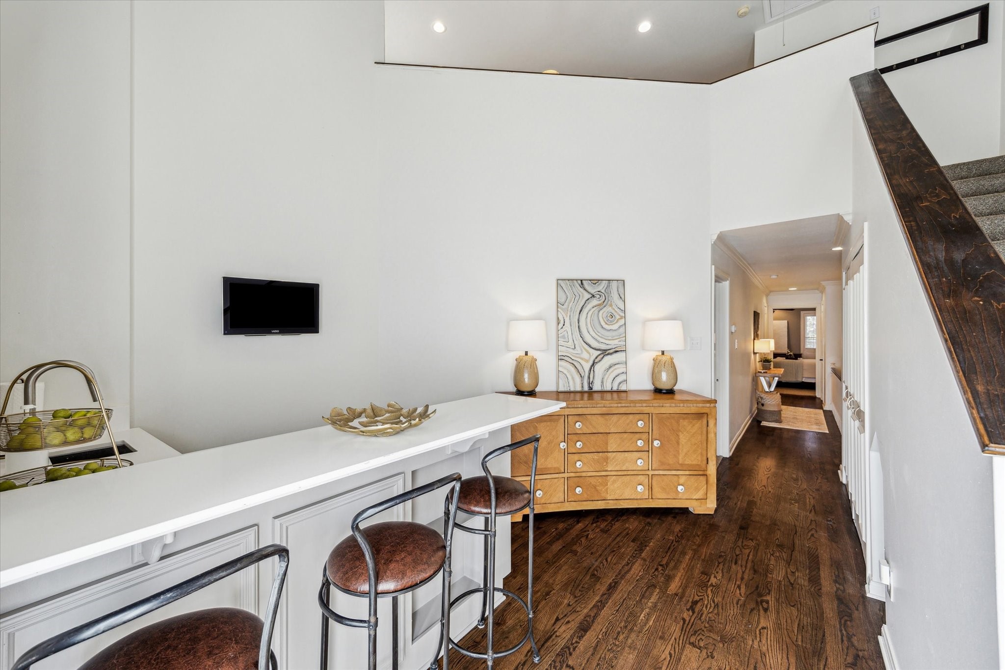 7523 Del Monte Drive Houston, TX 77063 - Photo 29 of 41 a room with a table chairs and wooden floor