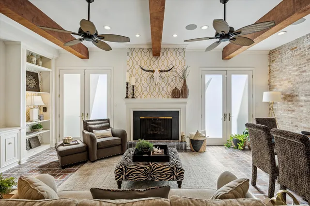 a living room with furniture fireplace and flat screen tv