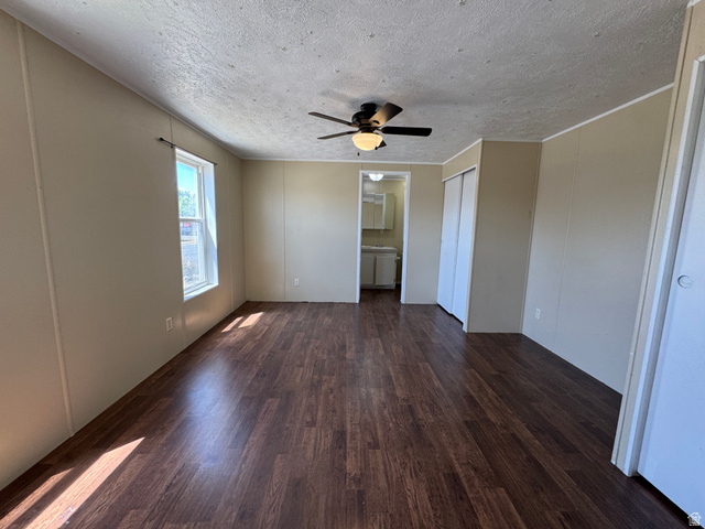2491 Highway 89, Unit 315 Pleasant View, UT 84404 - Photo 17 of 34 Spacious room featuring wood-finish flooring, a window providing natural light, and a ceiling fan with integrated lighting
