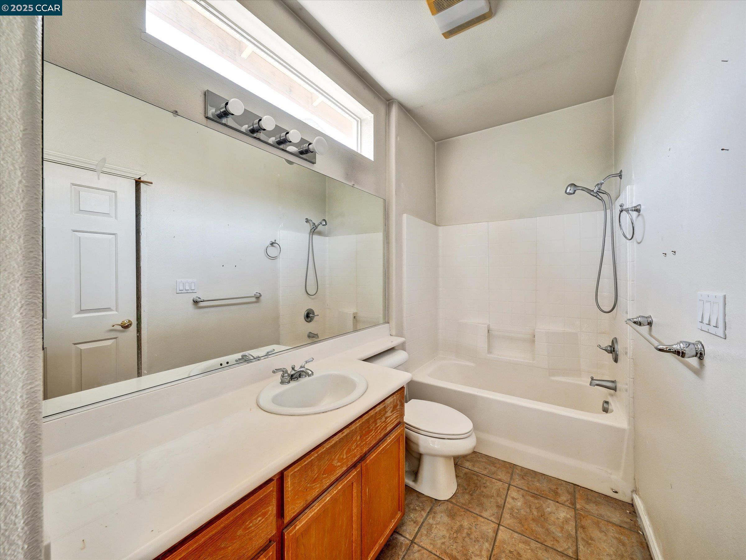 329 Brockton Place Rio Vista, CA 94571 - Photo 23 of 29 a bathroom with a sink a toilet and shower