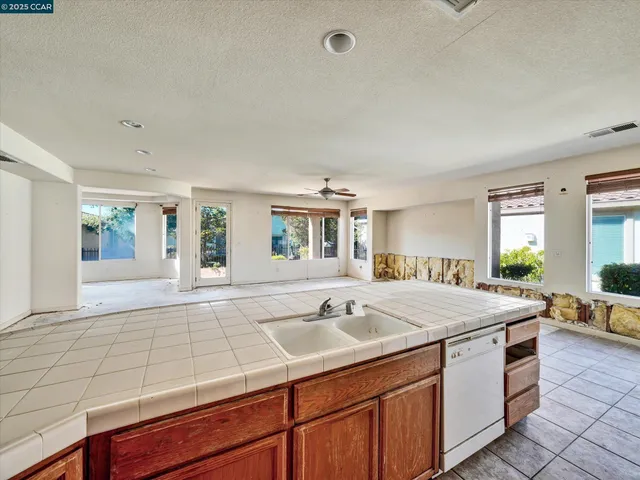 a kitchen with a stove and a refrigerator