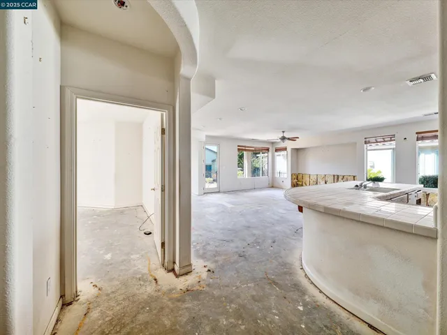 a view of a room with a floor to ceiling window and a living room