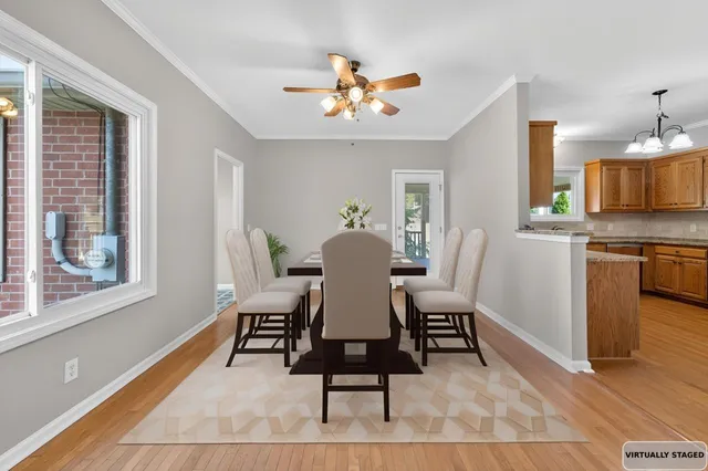 a view of a dining room with furniture window and wooden floor