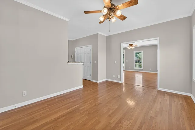 wooden floor in an empty room with a window