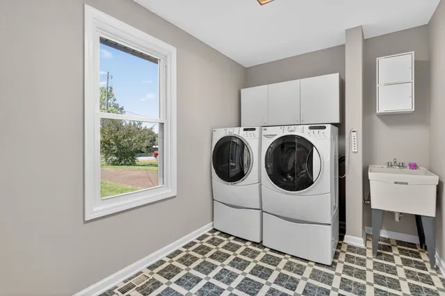 a utility room with dryer and washer