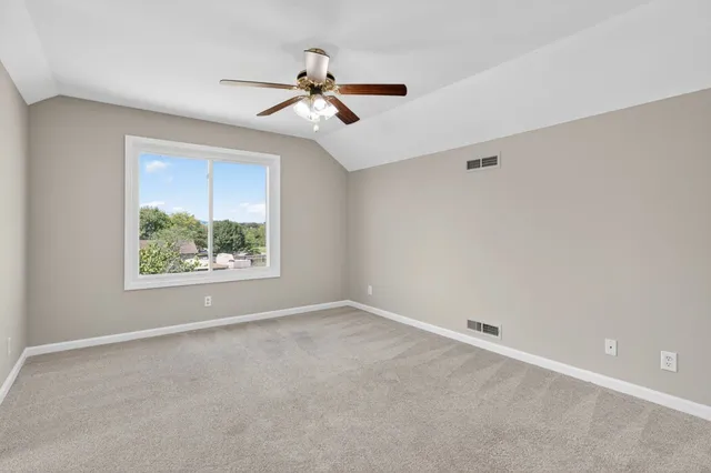 a view of a house with a yard and garage