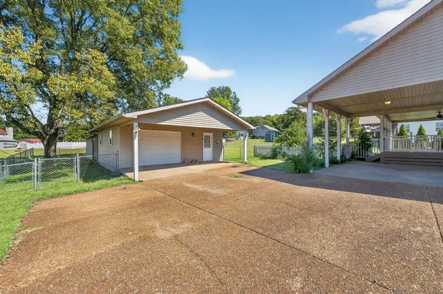 a view of a house with a street