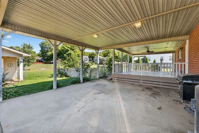 a view of porch with wooden floor