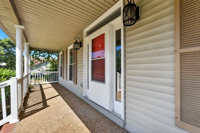 a view of a porch with wooden floor