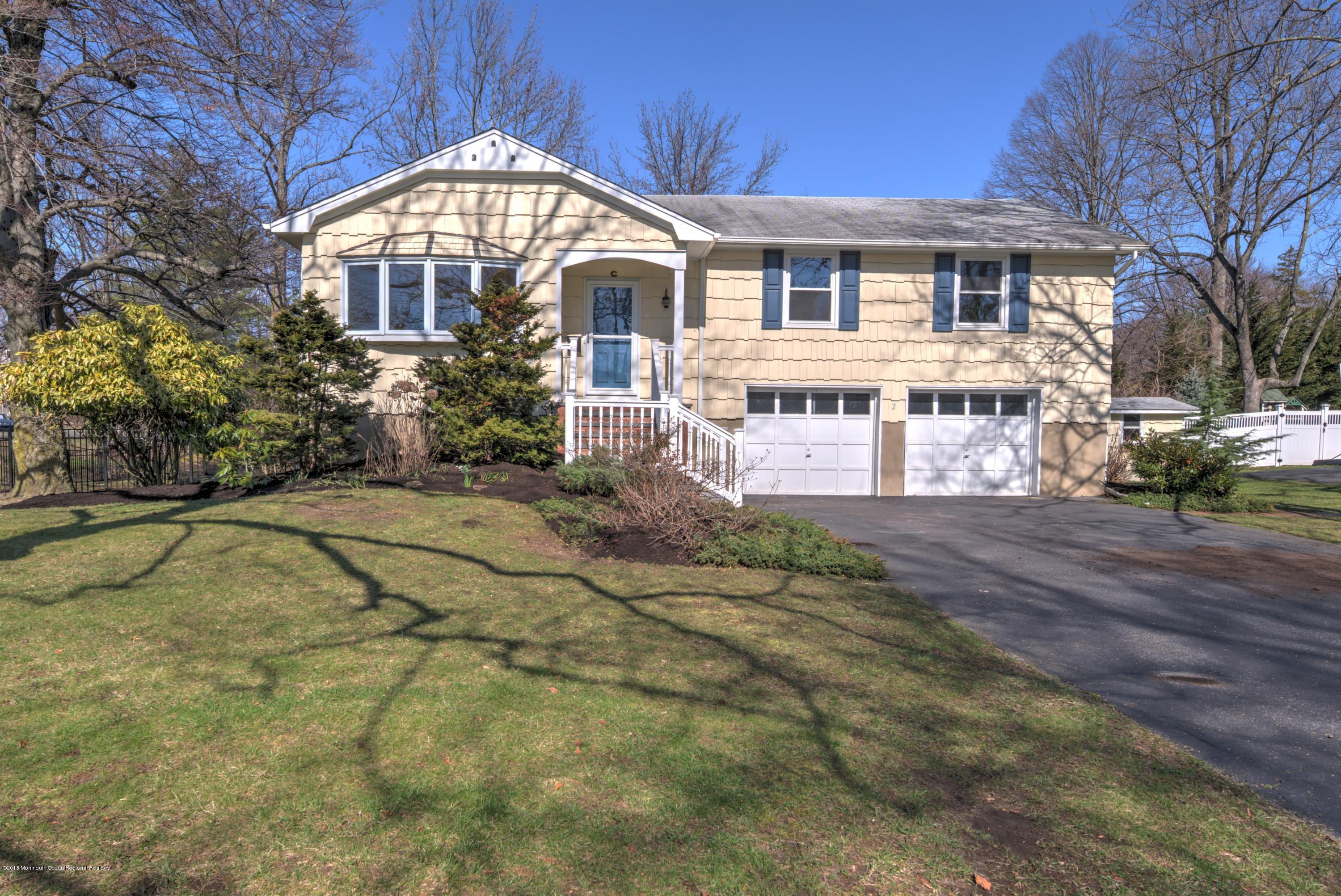 2 Ruddy Court Little Silver, NJ 07739 - Photo 1 of 19 a front view of a house with a yard