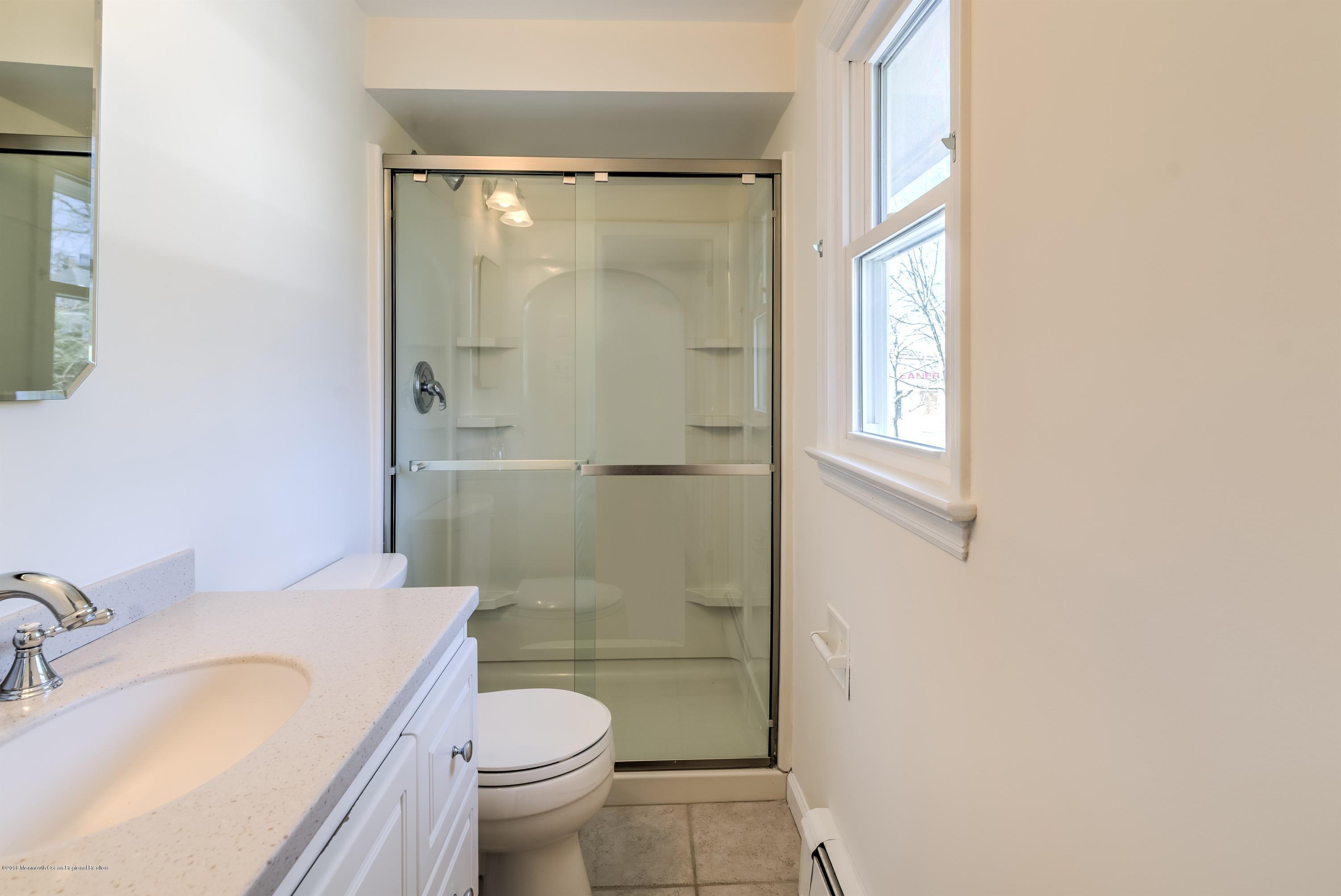 2 Ruddy Court Little Silver, NJ 07739 - Photo 11 of 19 a bathroom with a granite countertop sink toilet and shower