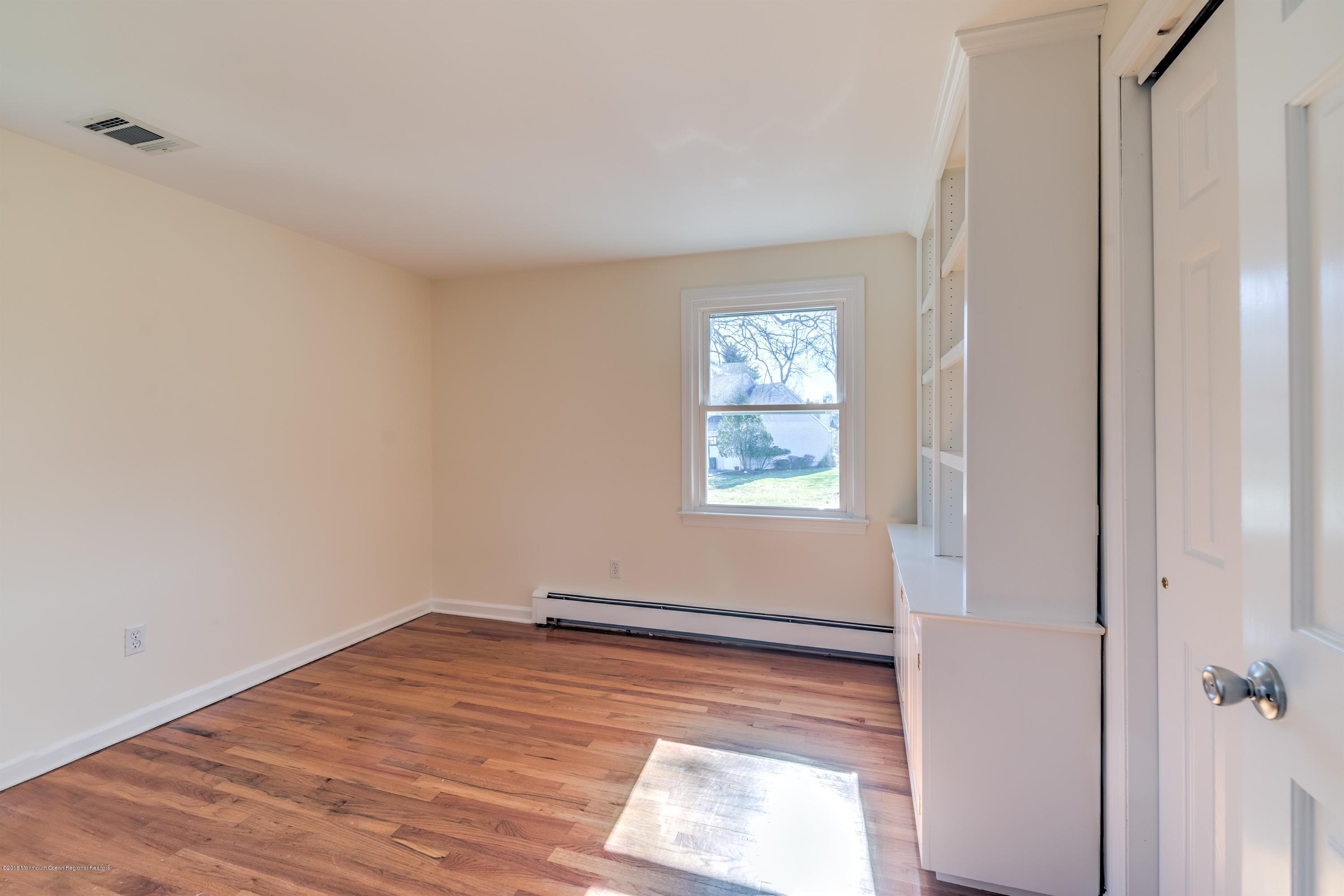 2 Ruddy Court Little Silver, NJ 07739 - Photo 12 of 19 a view of empty room with wooden floor and fan