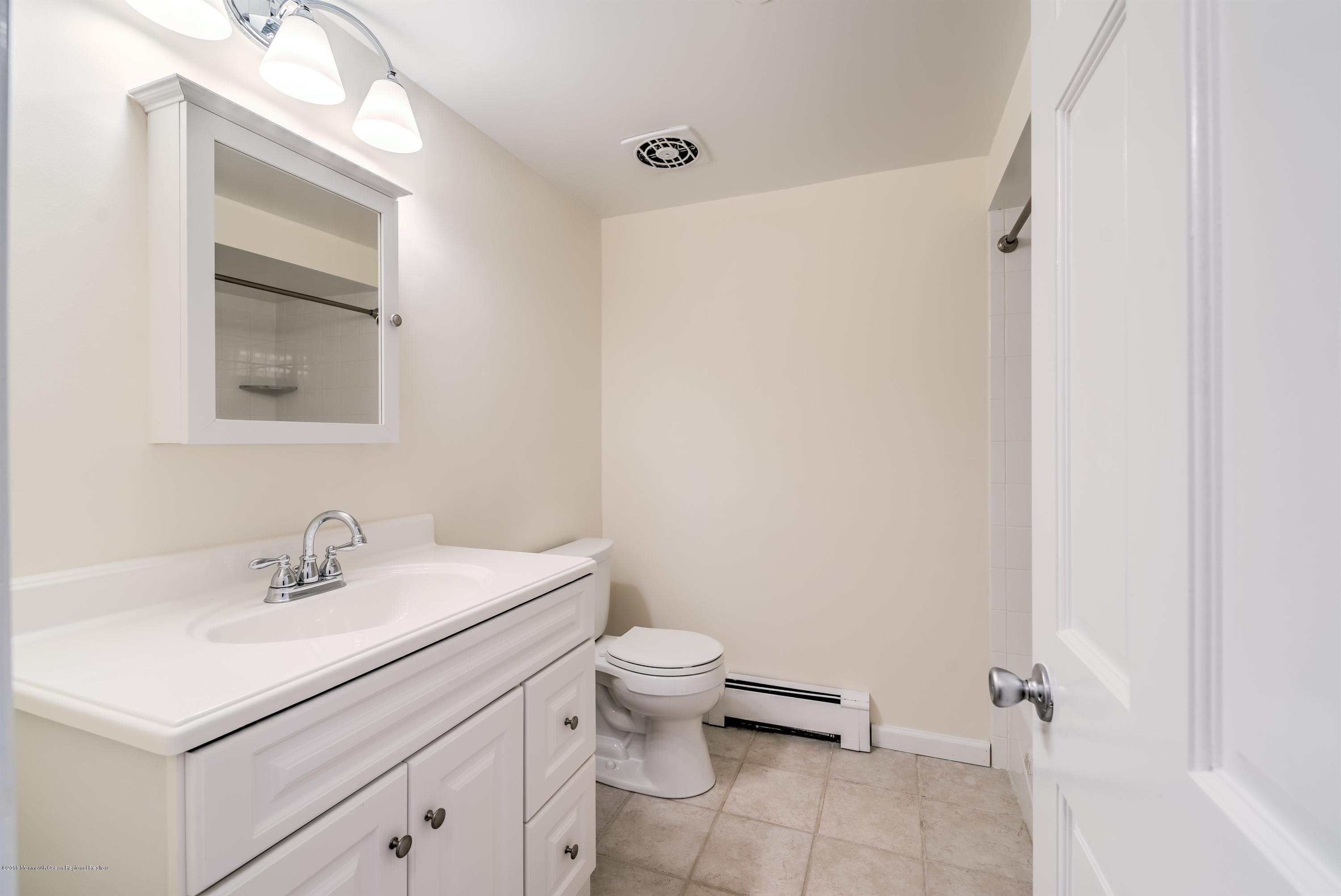 2 Ruddy Court Little Silver, NJ 07739 - Photo 14 of 19 a bathroom with a sink toilet and a mirror