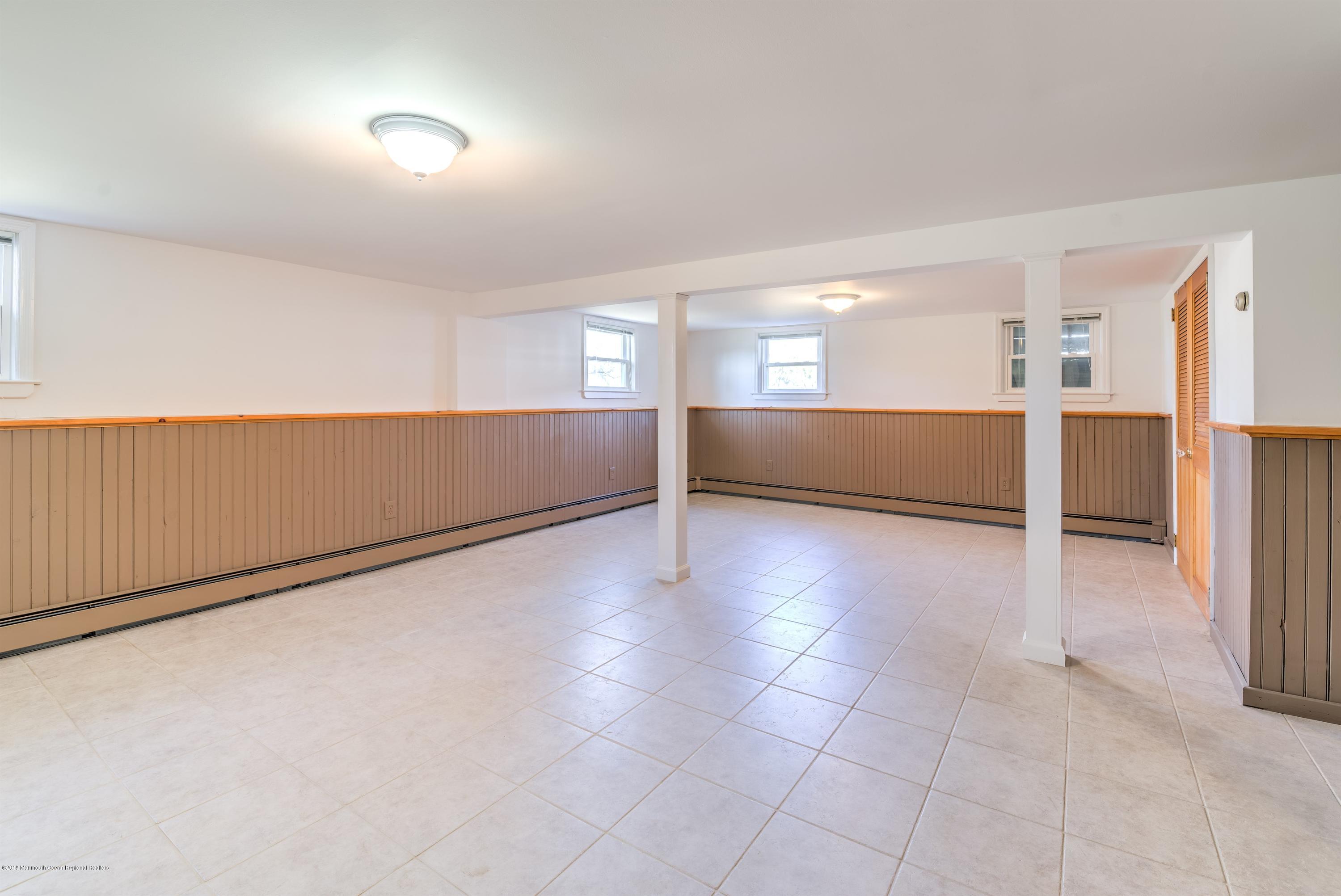 2 Ruddy Court Little Silver, NJ 07739 - Photo 15 of 19 wooden floor in an empty room with a window