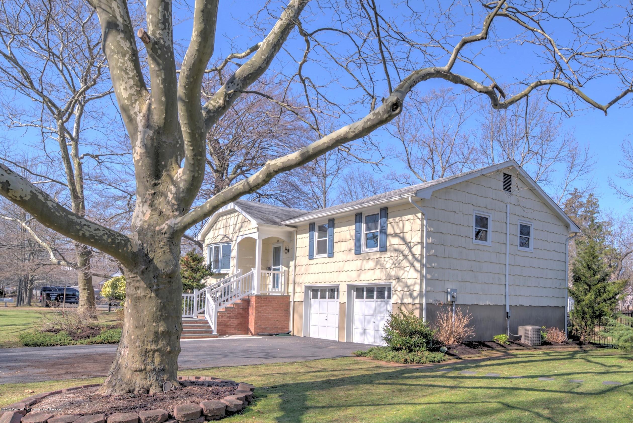 2 Ruddy Court Little Silver, NJ 07739 - Photo 2 of 19 a front view of a house with a yard